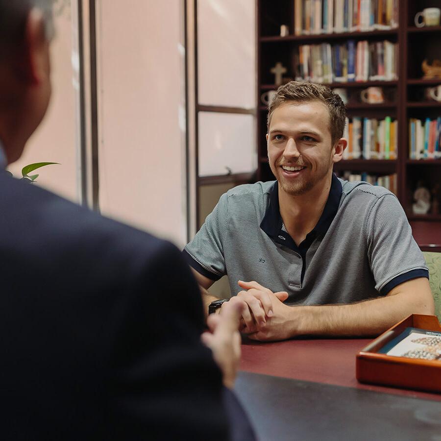 PBA student engages in discussion with an instructor.